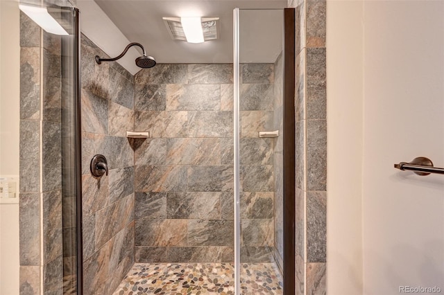 bathroom featuring a stall shower