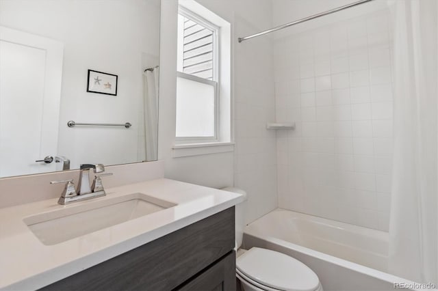 full bathroom featuring shower / tub combo, vanity, and toilet