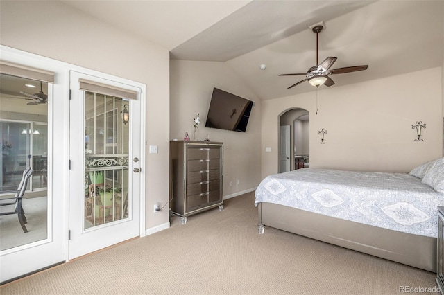 carpeted bedroom featuring vaulted ceiling, baseboards, access to outside, arched walkways, and ceiling fan