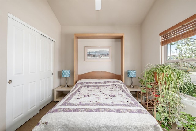 carpeted bedroom with a closet and ceiling fan