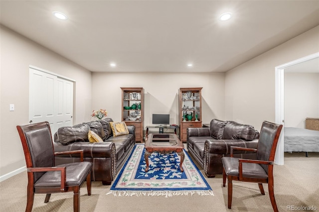 living room featuring light carpet, recessed lighting, and baseboards