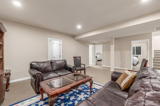 living room featuring carpet floors, baseboards, recessed lighting, and stairway