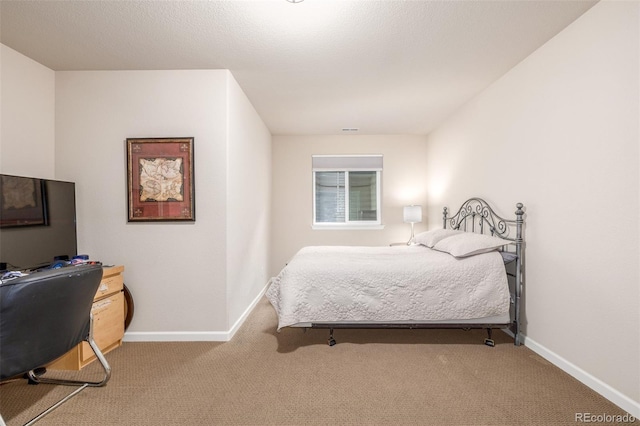 carpeted bedroom with baseboards