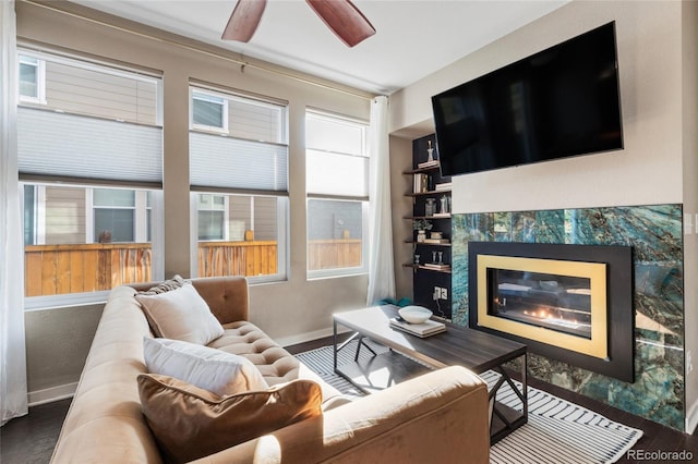 living room with ceiling fan, dark hardwood / wood-style floors, and a healthy amount of sunlight