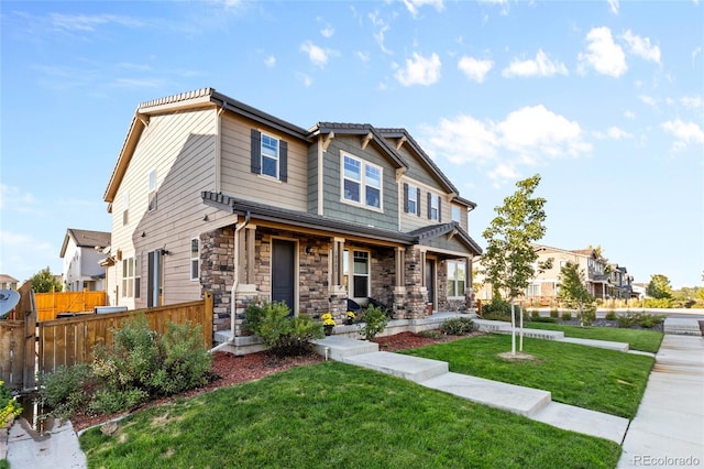 craftsman inspired home featuring a front yard and a porch