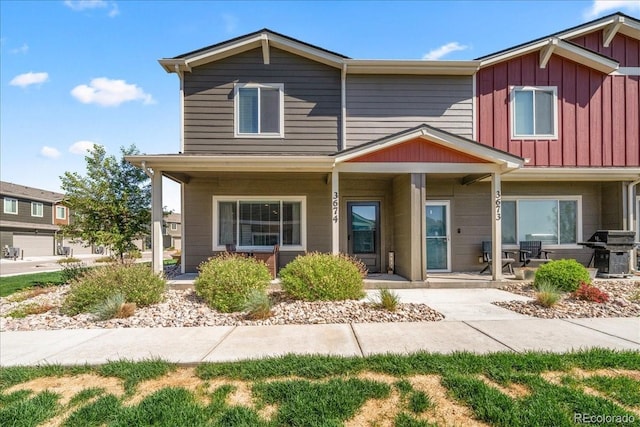 3674 Ronald Reagan Ave, Wellington, CO 80549 - view of front of home with board and batten siding and a porch