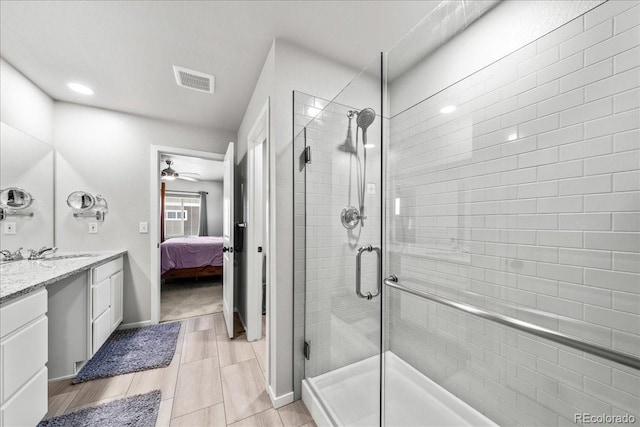 3674 Ronald Reagan Ave, Wellington, CO 80549 - bathroom featuring a stall shower, ensuite bath, vanity, and a ceiling fan