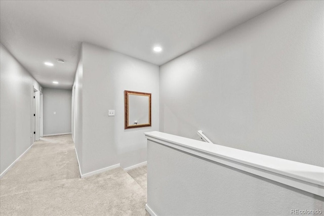 3674 Ronald Reagan Ave, Wellington, CO 80549 - hallway featuring an upstairs landing, light carpet, recessed lighting, and baseboards