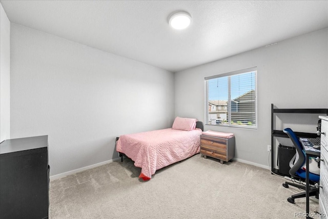 3674 Ronald Reagan Ave, Wellington, CO 80549 - bedroom with carpet floors, baseboards, and a desk