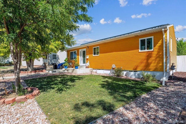 view of front facade with a front yard and central AC unit