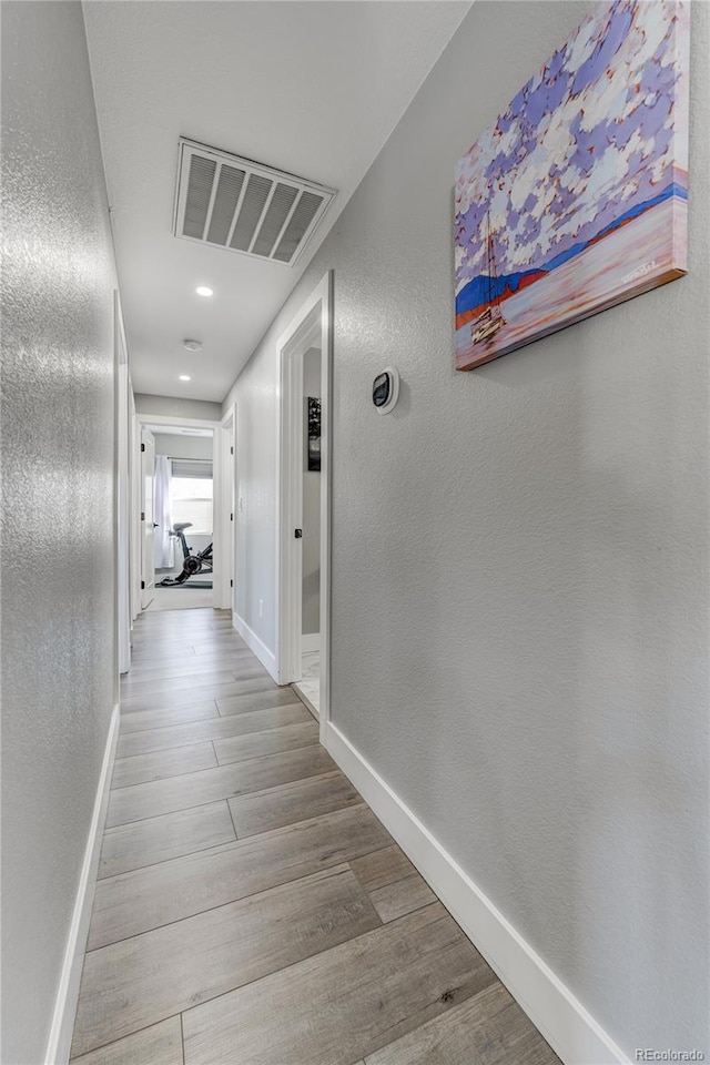 hallway featuring light wood-type flooring