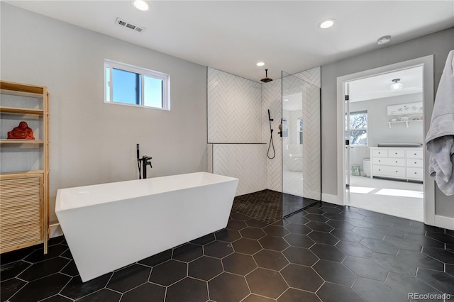 full bathroom with walk in shower, a soaking tub, recessed lighting, and tile patterned floors