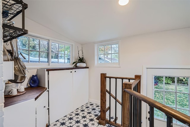 hallway featuring vaulted ceiling