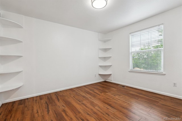 12702 E 105th Ave, Commerce City, CO 80022 - empty room with wood finished floors and baseboards