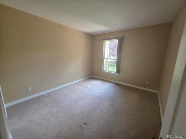 8911 Tappy Toorie Pl, Highlands Ranch, CO 80129 - carpeted empty room with baseboards