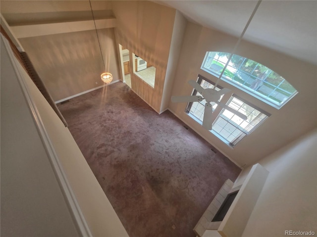 8911 Tappy Toorie Pl, Highlands Ranch, CO 80129 - unfurnished living room featuring carpet floors and plenty of natural light