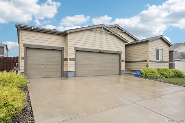 2328 Saddle Back Ct, Fort Lupton, CO 80621 - view of front of home featuring a garage and concrete driveway