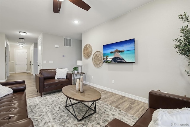 2328 Saddle Back Ct, Fort Lupton, CO 80621 - living area featuring light wood-style flooring, baseboards, and ceiling fan
