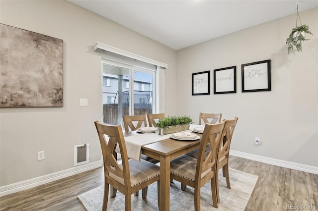 2328 Saddle Back Ct, Fort Lupton, CO 80621 - dining space with light wood-style floors and baseboards
