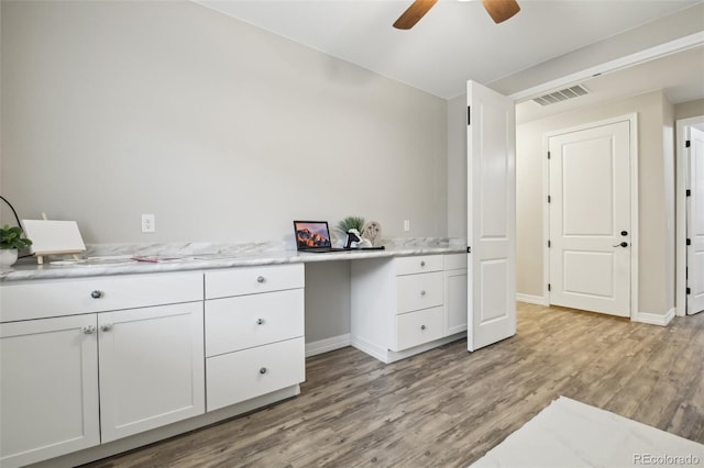 2328 Saddle Back Ct, Fort Lupton, CO 80621 - office area with light wood-style floors, baseboards, built in study area, and ceiling fan