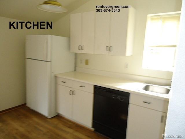 28127 Knowles Rd Unit A, B, & C, Evergreen, CO 80439 - kitchen featuring dishwasher, freestanding refrigerator, and white cabinets