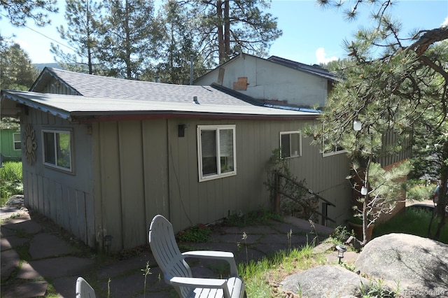 28127 Knowles Rd Unit A, B, & C, Evergreen, CO 80439 - view of side of property with roof with shingles and board and batten siding