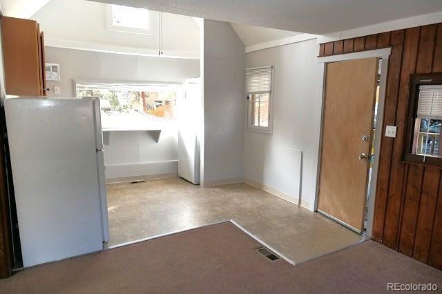 28127 Knowles Rd Unit A, B, & C, Evergreen, CO 80439 - entrance foyer with vaulted ceiling and wooden walls