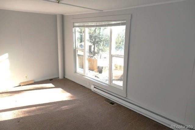 28127 Knowles Rd Unit A, B, & C, Evergreen, CO 80439 - carpeted empty room featuring a baseboard heating unit