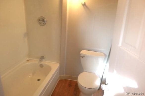 28127 Knowles Rd Unit A, B, & C, Evergreen, CO 80439 - bathroom with wood finished floors and bathtub / shower combination