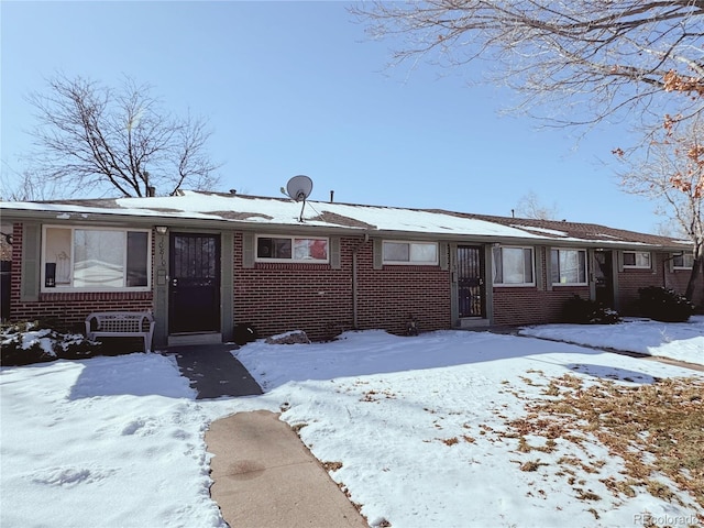 view of front of house featuring brick siding