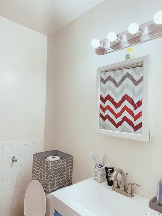 bathroom with toilet and sink