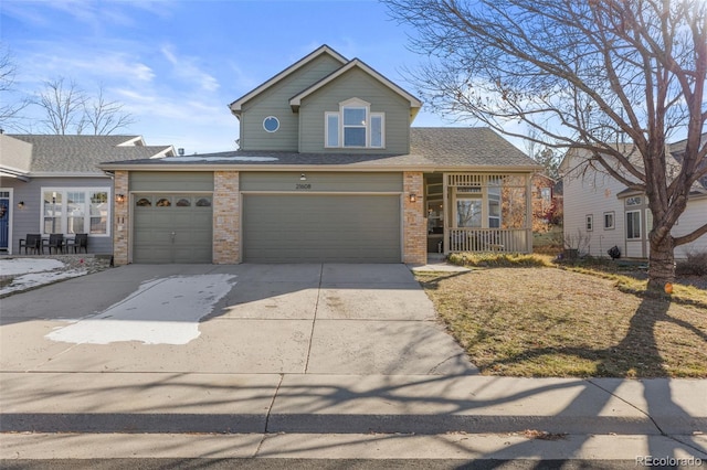 view of front of property featuring covered porch and a garage