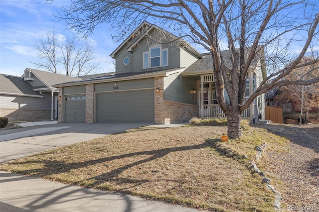 view of front property featuring covered porch and a garage