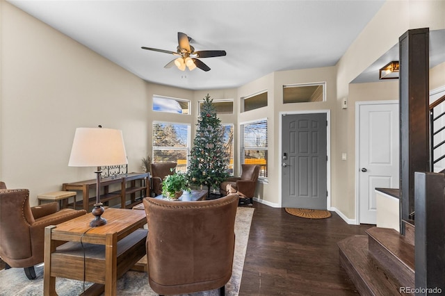 living area with ceiling fan and dark wood-type flooring