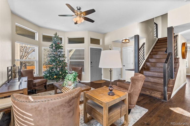 living room with ceiling fan and dark wood-type flooring