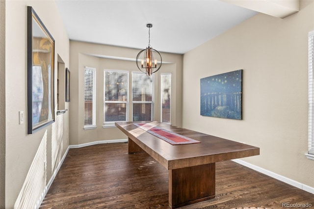 unfurnished dining area with dark hardwood / wood-style flooring and an inviting chandelier