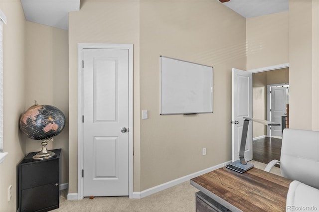 office area featuring light colored carpet