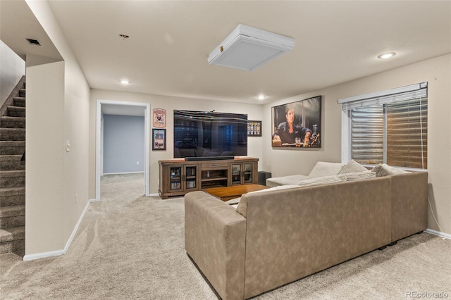 living room featuring light carpet