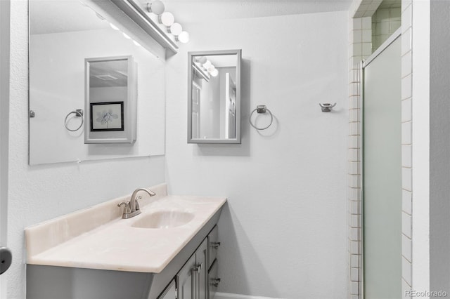 bathroom with vanity and walk in shower