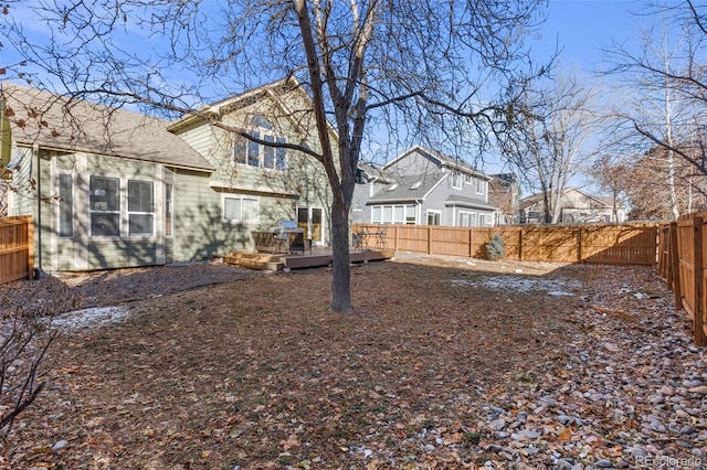 view of yard with a wooden deck