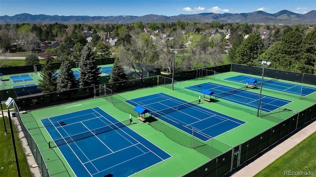 9867 W Berry Dr, Littleton, CO 80123 - view of tennis court featuring fence and a mountain view