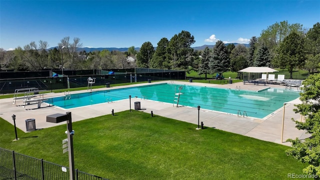 9867 W Berry Dr, Littleton, CO 80123 - community pool featuring a mountain view and a patio area