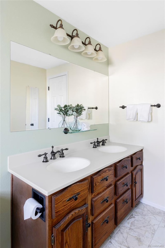 9867 W Berry Dr, Littleton, CO 80123 - bathroom with double vanity and marble look tiles
