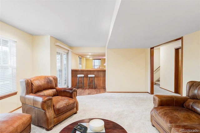 9867 W Berry Dr, Littleton, CO 80123 - living area featuring carpet flooring, stairs, and baseboards