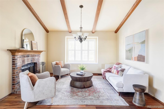 9867 W Berry Dr, Littleton, CO 80123 - living room with a chandelier, wood finished floors, a fireplace, and baseboards