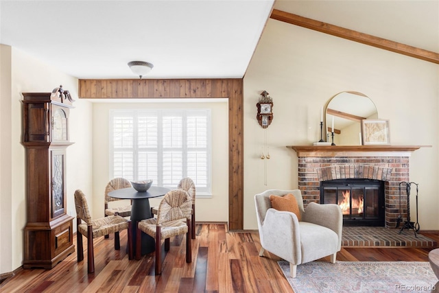 9867 W Berry Dr, Littleton, CO 80123 - living area with a brick fireplace and wood finished floors