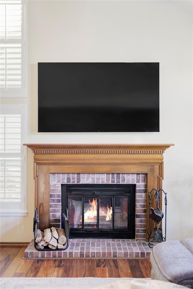 9867 W Berry Dr, Littleton, CO 80123 - detailed view of a fireplace and wood finished floors