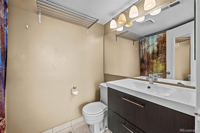 full bathroom with visible vents, toilet, vanity, and tile patterned floors