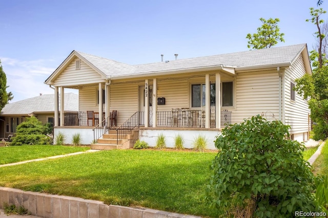 5422 S Nevada St, Littleton, CO 80120 - ranch-style house with a shingled roof, a porch, and a front lawn