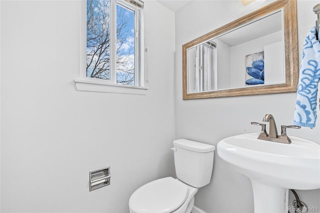 bathroom featuring a sink and toilet